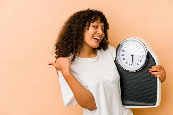 Young African American Afro Woman Holding Scale Points Thumb Finger — Stock Photo, Image