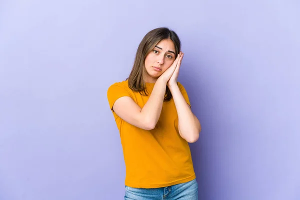 stock image Young caucasian woman yawning showing a tired gesture covering mouth with hand.