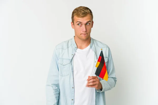 Young Caucasian Man Holding German Flag Isolated White Background Showing — Stock Photo, Image