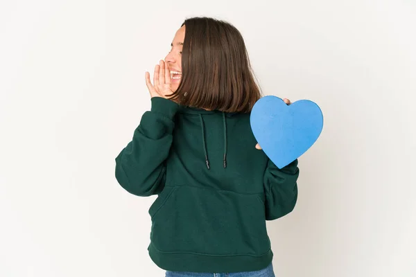 Young Hispanic Woman Holding Heart Shape Shouting Holding Palm Opened — Stock Photo, Image