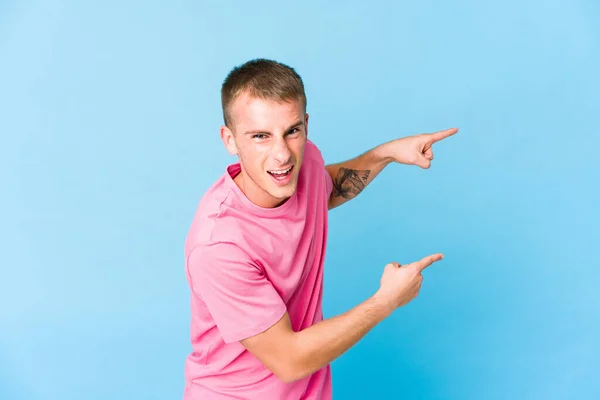 Young Caucasian Handsome Man Pointing Forefingers Copy Space Expressing Excitement — Stock Photo, Image