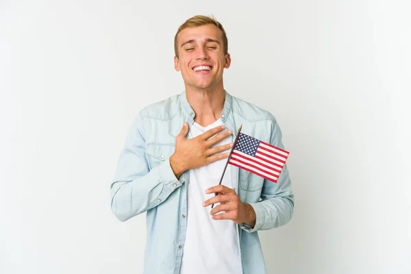 Young Caucasian Man Holding American Flag Isolated White Background Laughs — Stock Photo, Image