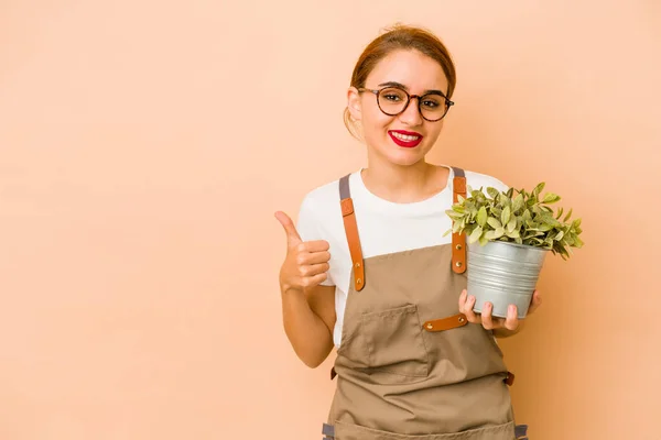 Jovem Magro Árabe Jardineiro Mulher Sorrindo Levantando Polegar Para Cima — Fotografia de Stock