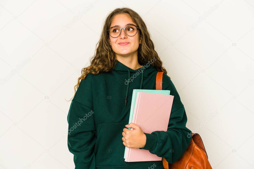 Young caucasian student woman isolated dreaming of achieving goals and purposes