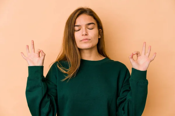 stock image Young skinny caucasian teenager girl relaxes after hard working day, she is performing yoga.