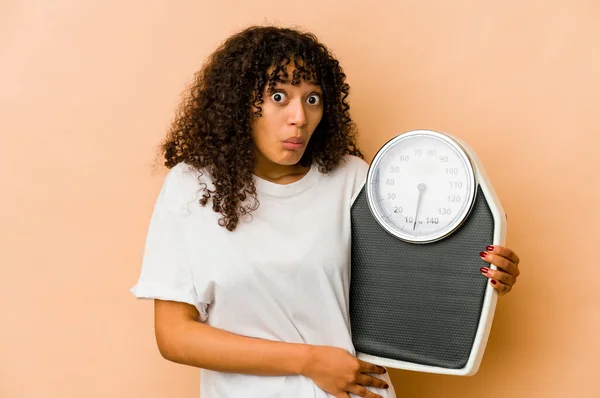 Young African American Afro Woman Holding Scale Shrugs Shoulders Open — Stock Photo, Image