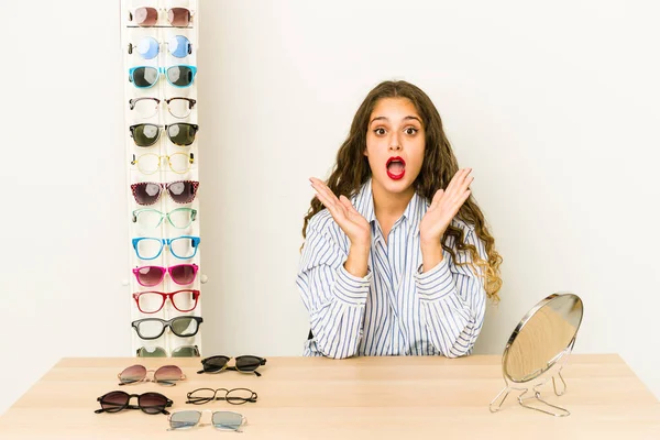 Young Caucasian Woman Trying Glasses Isolated Surprised Shocked — Stock Photo, Image