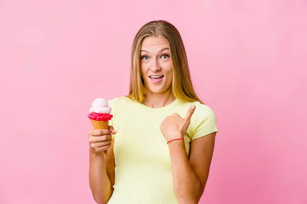 Young Russian Woman Eating Ice Cream Isolated Surprised Pointing Finger — Stock Photo, Image