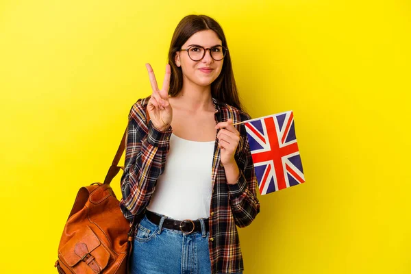 Junge Frau Studiert Englisch Isoliert Auf Rosa Hintergrund Zeigt Nummer — Stockfoto