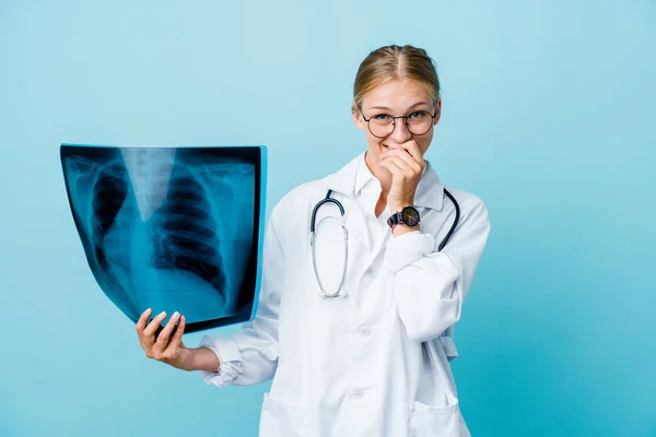 Young Russian Doctor Woman Holding Bone Scan Blue Laughing Something — Stock Photo, Image