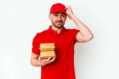 Beyaz arka planda izole genç beyaz dağıtım adam şok, o önemli bir toplantı hatırladı.