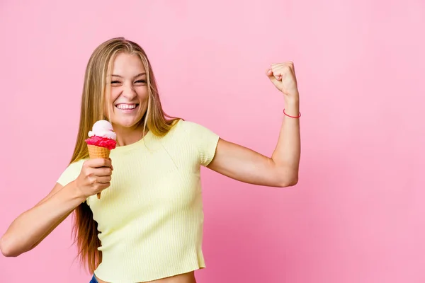 Young Russian Woman Eating Ice Cream Isolated Raising Fist Victory — Stock Photo, Image