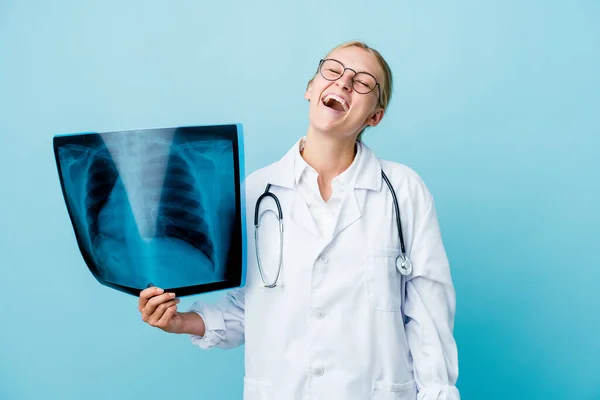 Young Russian Doctor Woman Holding Bone Scan Blue Relaxed Happy — Stock Photo, Image