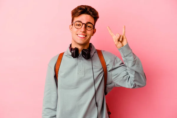 Young Student Man Isolated Pink Background Showing Horns Gesture Revolution — Stock Photo, Image