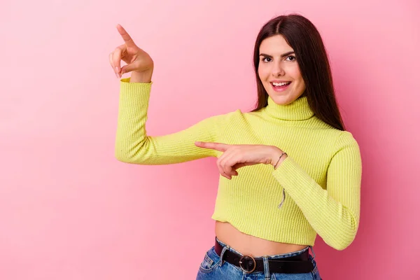 Young Caucasian Woman Isolated Pink Background Excited Pointing Forefingers Away — Stock Photo, Image