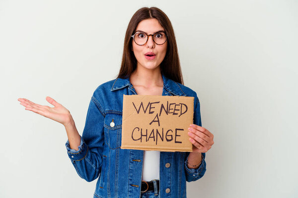 Young caucasian woman holding protect our planet placard isolated being shocked, she has remembered important meeting.