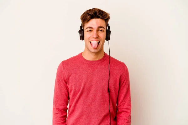 Young Caucasian Man Listening Music Isolated White Background Funny Friendly — Stock Photo, Image