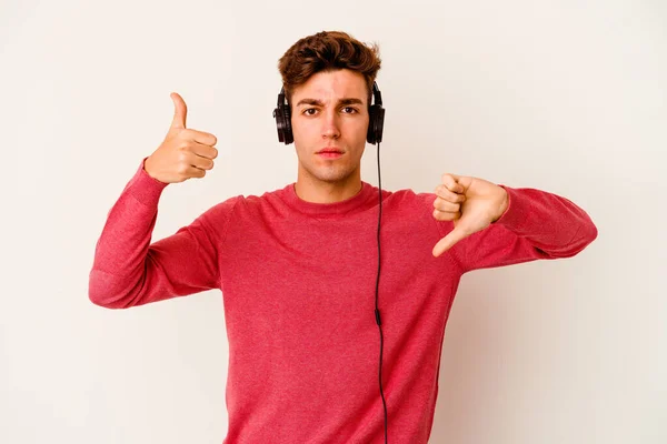 Young Caucasian Man Listening Music Isolated White Background Showing Thumbs — Stock Photo, Image