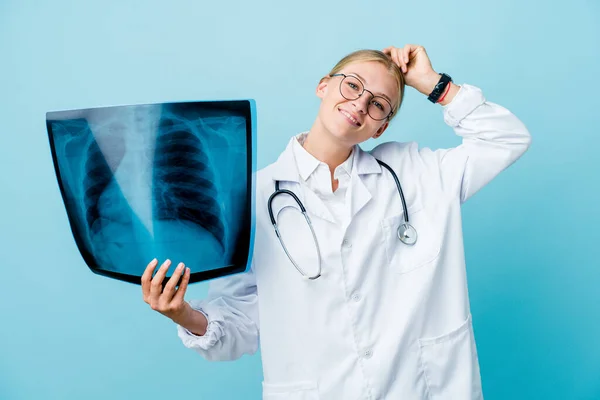 Young Russian Doctor Woman Holding Bone Scan Blue Stretching Arms — Stock Photo, Image