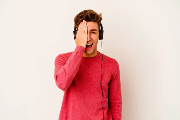 Young Caucasian Man Listening Music Isolated White Background Having Fun — Stock Photo, Image