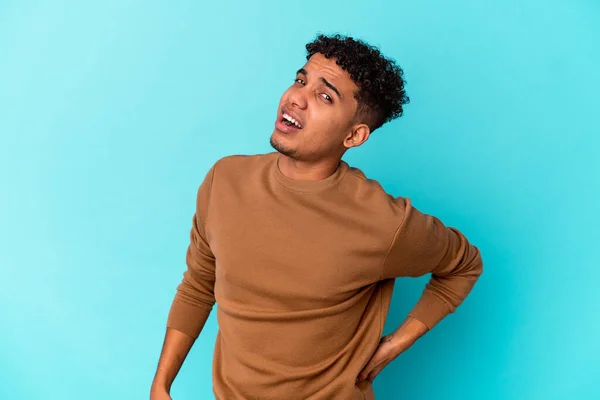 Young African American Curly Man Isolated Blue Suffering Back Pain — Stock Photo, Image