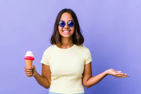Young Mixed Race Woman Eating Ice Cream Showing Welcome Expression — 图库照片