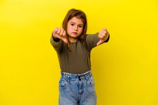 Little Caucasian Girl Isolated Yellow Background Showing Thumb Disappointment Concept — Stock Photo, Image
