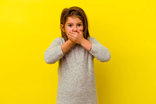 Little Caucasian Girl Isolated Yellow Background Covering Mouth Hands Looking — Stock Photo, Image