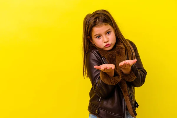 Little Caucasian Girl Isolated Yellow Background Folding Lips Holding Palms — Stock Photo, Image