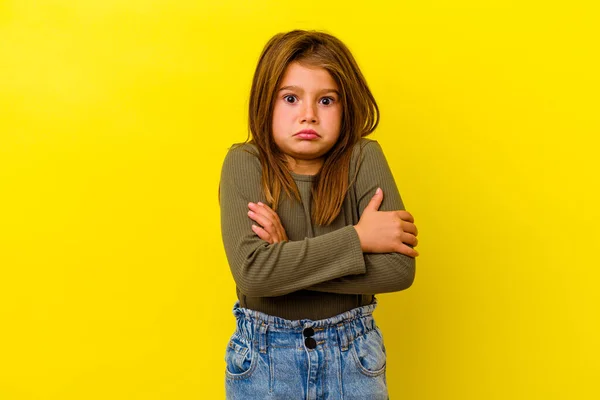 Little Caucasian Girl Isolated Yellow Background Shrugs Shoulders Open Eyes — Stock Photo, Image