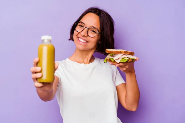 Young Mixed Race Woman Holding Healthy Smoothie Sandwich Isolated Purple — Stock Photo, Image