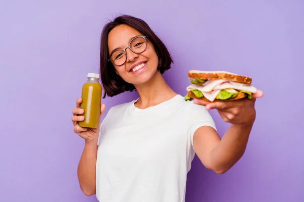 Young Mixed Race Woman Holding Healthy Smoothie Sandwich Isolated Purple — Stock Photo, Image