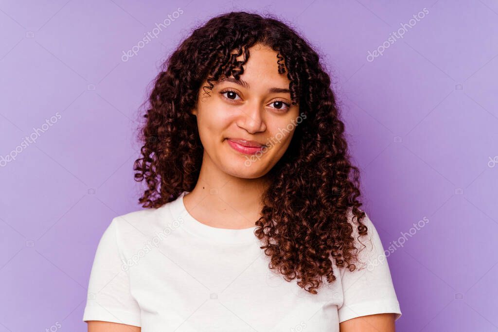 Young mixed race woman closeup isolated on purple background