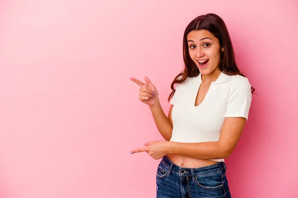 Young Indian Woman Isolated Pink Background Excited Pointing Forefingers Away — Stock Photo, Image