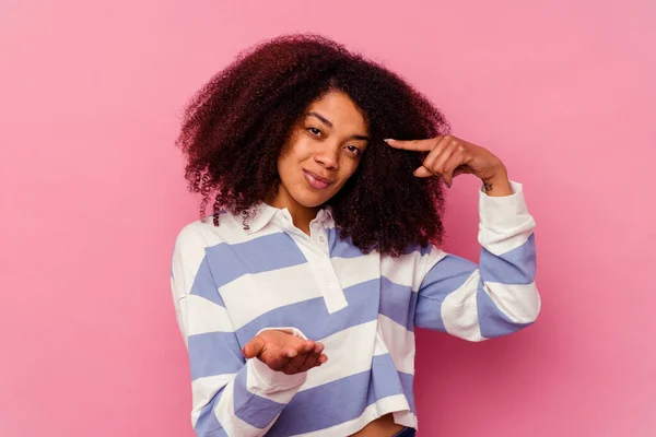 Young African American Woman Isolated Pink Background Holding Showing Product — Stock Photo, Image