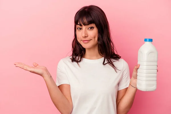 Young Caucasian Woman Holding Bottle Milk Isolated Pink Background Showing — Stock Photo, Image