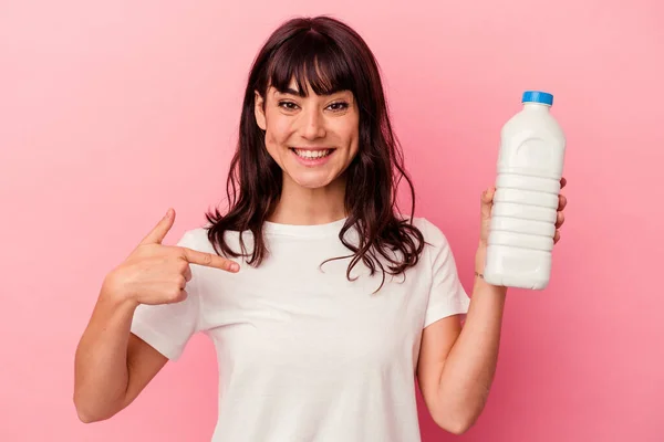 Young Caucasian Woman Holding Bottle Milk Isolated Pink Background Person — Stock Photo, Image
