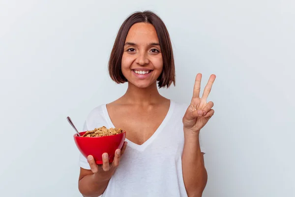 Young Mixed Race Woman Eating Cereals Isolated White Background Showing — Stock Photo, Image