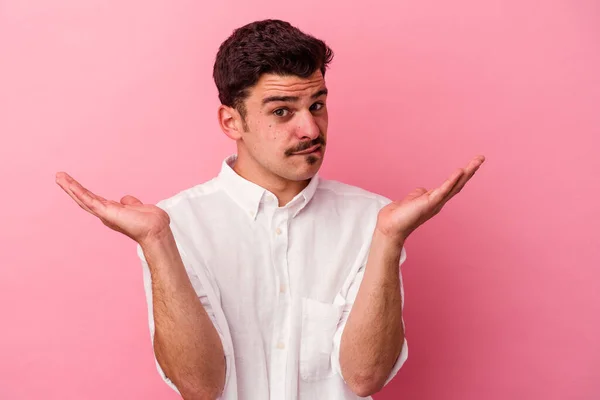 Young Caucasian Man Isolated Pink Background Confused Doubtful Shrugging Shoulders — Stock Photo, Image