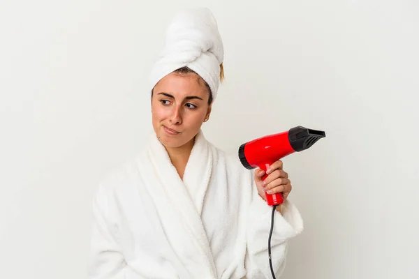 Young Caucasian Woman Holding Hair Dryer Isolated White Confused Feels — Stock Photo, Image