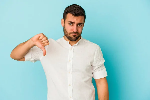 Young Caucasian Man Isolated Blue Background Showing Thumb Disappointment Concept — Stock Photo, Image