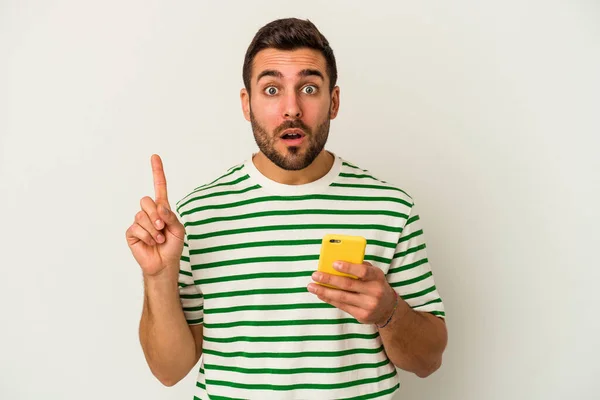 Young Caucasian Man Holding Mobile Phone Isolated White Background Having — Stock Photo, Image