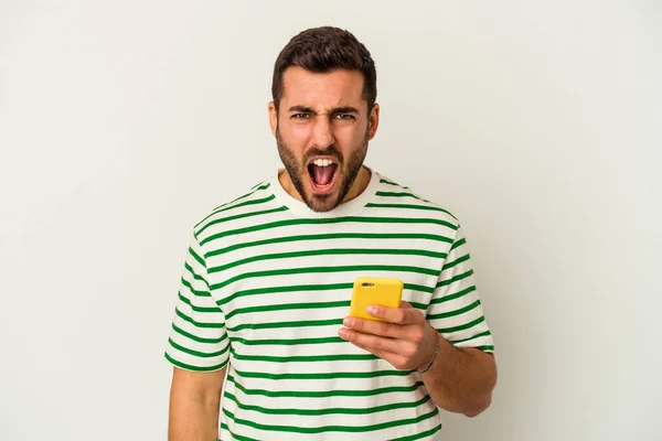 Young Caucasian Man Holding Mobile Phone Isolated White Background Screaming — Stock Photo, Image