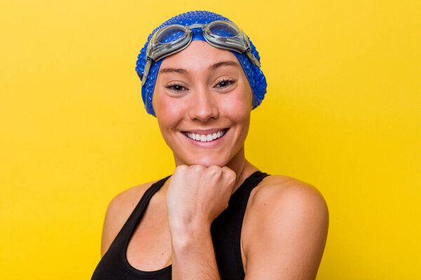 Young australian swimmer woman isolated on yellow background