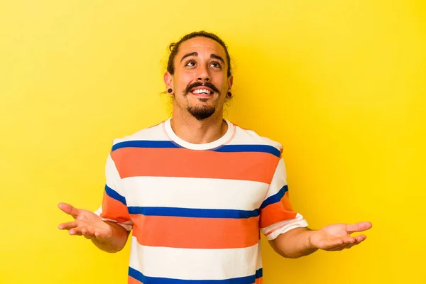 Young Caucasian Man Long Hair Isolated Yellow Background Joyful Laughing — Stock Photo, Image