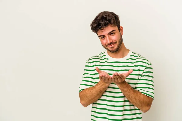 Jovem Caucasiano Isolado Fundo Branco Lábios Dobráveis Segurando Palmas Para — Fotografia de Stock