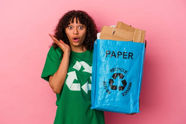 Young Caucasian Woman Holding Recycled Plastic Isolated Pink Background Surprised — Stock Photo, Image