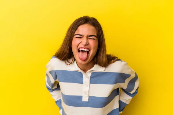 Young Caucasian Woman Isolated Yellow Background Funny Friendly Sticking Out — Stock Photo, Image