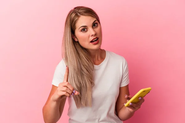 Young Russian Woman Holding Mobile Phone Isolated Pink Background Having — Stock Photo, Image