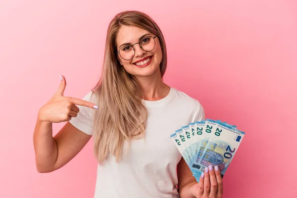 Young Russian Woman Holding Bills Isolated Pink Background Person Pointing — Stock Photo, Image